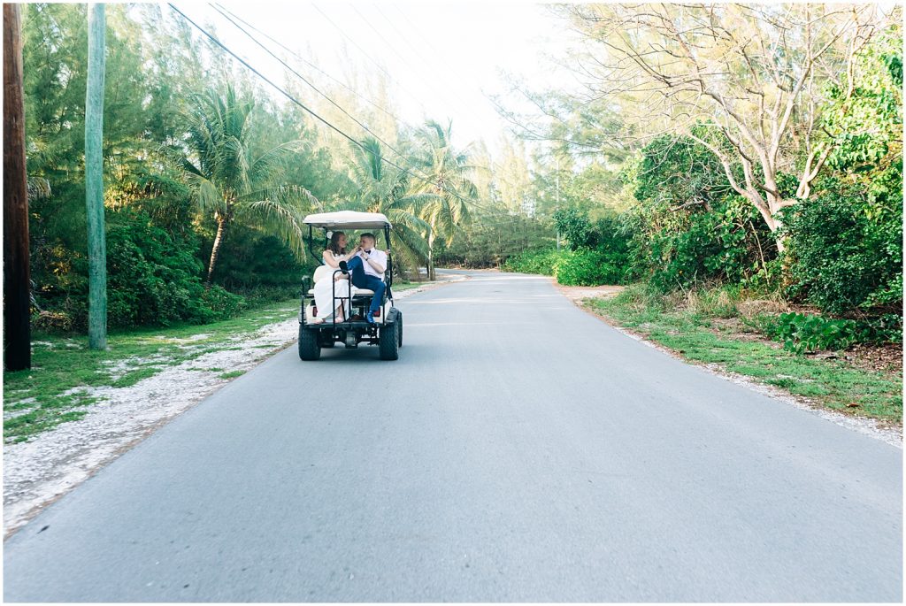 bride and groom in golf cart on green turtle cay