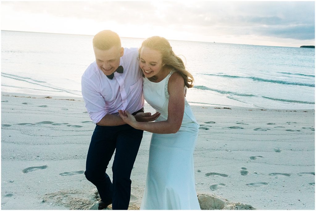 beach portraits with bride and groom in the bahamas