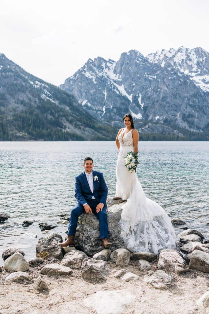 A bride and groom on the shore of Lake Jenny in Teton National park during their intimate elopement day